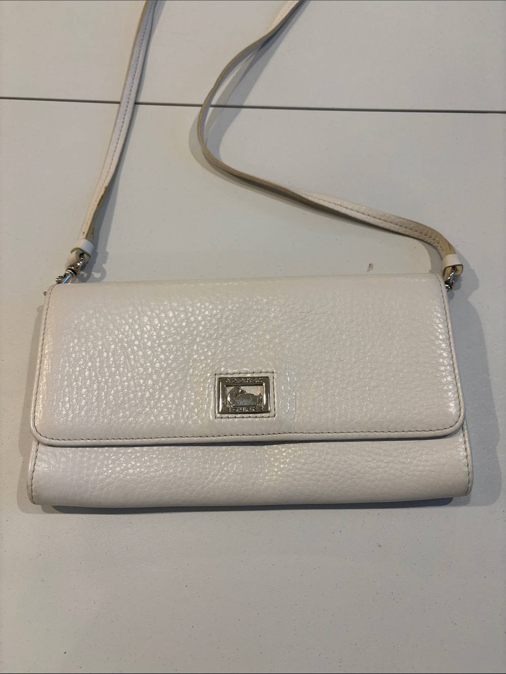 White Dooney & Bourke Leather Crossbody Bag with Metal Logo Plaque